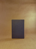 A black paper folder in The Daily pocket journal sizing 