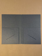 The inside of the black paper folder in The Chronicle Book bag journal sizing 