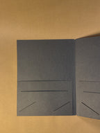 The inside of the black paper folder in The Archive Desk journal sizing 