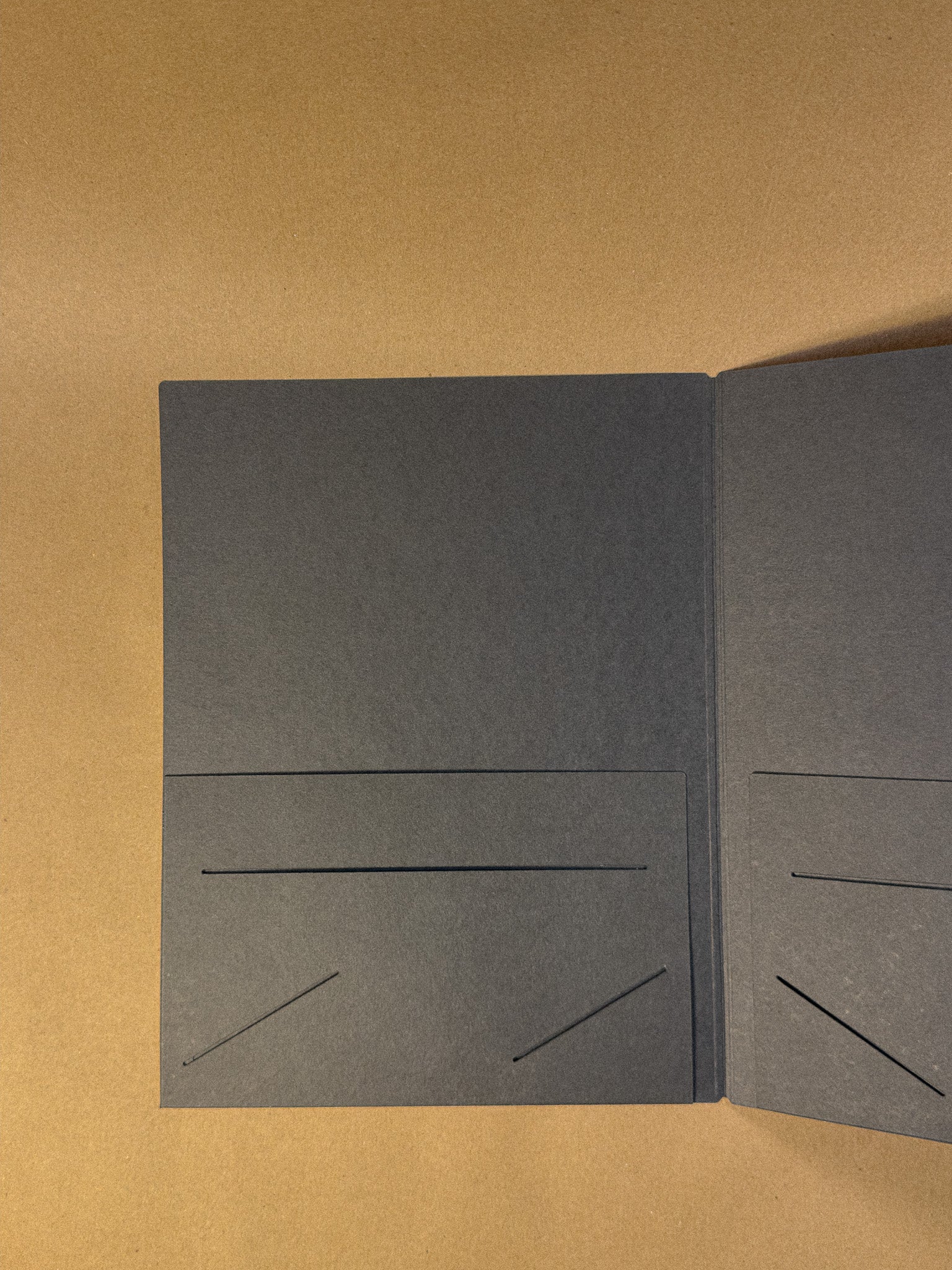 The inside of the black paper folder in The Archive Desk journal sizing 